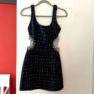 Beautiful, fashionable little black dress with a twist.